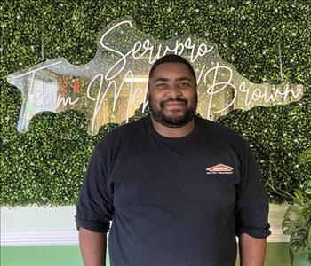 Young man standing with a Servpro shirt on